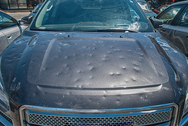 Hail damage to a car during a big storm